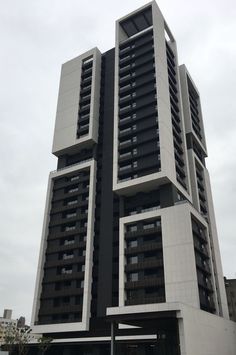 a very tall building with many windows and balconies