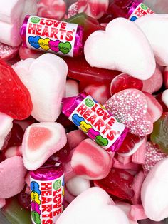 a bowl filled with lots of heart shaped candy