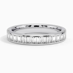 a white gold wedding band with baguettes set in the center and channeled sides