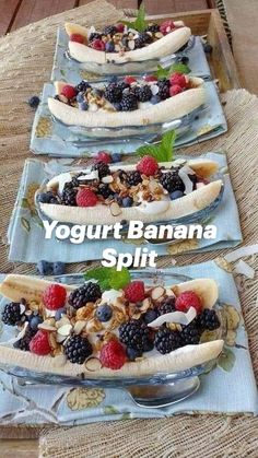 three plates with bananas and berries on them