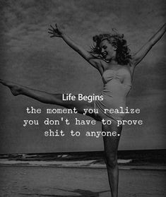 a woman in white dress standing on one leg with her arms spread out and the words life begins, the moment you realize you don't have to prove