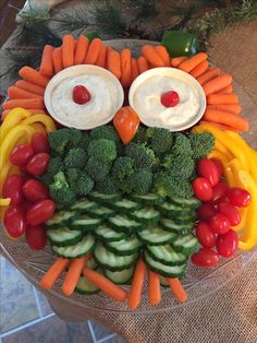 an owl made out of veggies and dips on top of each other