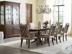 a dining room table with many chairs around it