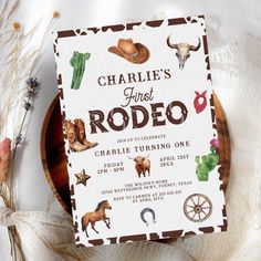 a rodeo themed birthday party is shown on a plate with flowers and cacti