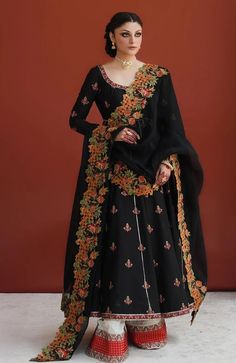 Pakistani Black Dress In Pishwas Style For Wedding Black Gown With Dabka Work For Reception, Anarkali Gown With Intricate Embroidery For Traditional Ceremonies, Anarkali Dola Silk Dresses For Traditional Ceremonies, Anarkali Organza Gown For Traditional Ceremonies, Raw Silk Dresses With Resham Embroidery For Traditional Ceremonies, Wedding Lehenga With Dabka Work In Black, Embroidered Floor-length Lehenga For Formal Occasions, Embroidered Floor-length Lehenga For Formal Events, Black Wedding Lehenga With Dabka Work