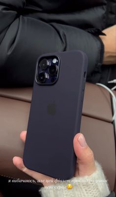 a person holding up an iphone case in their hand, with the back cover open