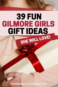 a woman holding a gift box with the words 39 fun gimmore girls gift ideas she will love