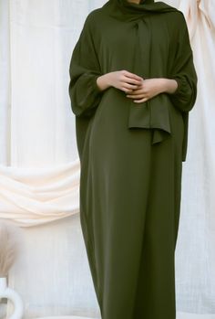 This Prayer Dress is the perfect blend of comfort and class. Our elegant abaya gives you a polished look with added pockets and an attached hijab without needing multiple pieces to worry about. Creating a look that is both sophisticated and convenient, you can get ready in no time for prayer and step out in it for errands after if you need to! Product measurements: Size (in/cm) Bust Waist Sleeves Length One-size 54in/ 137.2cm 53.9in/ 136.9cm 26in/ 66cm 55in/ 140cm Details: One-Piece High Quality Elegant Solid Color Abaya For Fall, Elegant Solid Abaya For Fall, Elegant Long Abaya For Workwear, Solid Color Maxi Length Abaya For Work, Elegant Workwear Abaya In Maxi Length, Solid Maxi Length Abaya For Work, Maxi Length Abaya For Fall Workwear, Solid Color Long Sleeve Abaya For Work, Long Sleeve Abaya For Work