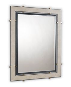 a mirror that is on the wall with some metal bars around it and an opening at the bottom