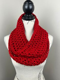 Handmade crochet scarf  Yarn is 97% acrylic               3% metallic fiber   Color: Red twinkle (BT)  Length is 60 inches  Care Instructions: Hand wash and lay flat to dry. Red Hand Knitted Scarves One Size, Red Hand Knitted Scarf One Size, Infinity Scarf Crochet, Red Infinity, Scarf Yarn, Crochet Infinity Scarf, Red Sparkle, Scarf Crochet, Red Scarves