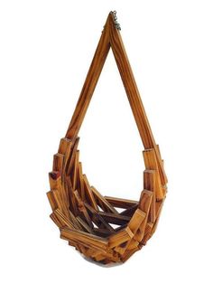 a bag made out of bamboo sticks on a white background