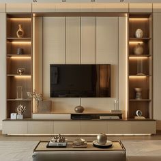 a modern living room with built in shelves and a flat screen tv on the wall