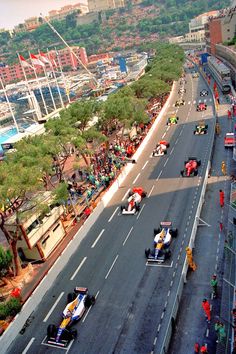 a group of people riding karts down a street