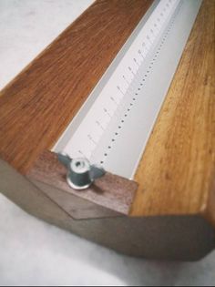 a wooden table with a ruler on it