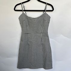 Urban Outfitters Black & White Gingham Check Dress. Adjustable Straps. Dainty Eyelet Trim At Neckline And Back Zip Closure. Size Small Spring Black Plaid Mini Length Dress, Spring Black Plaid Mini Dress, Black Plaid Mini Dress For Spring, Black Mini Length Plaid Dress For Spring, Spring Plaid Lined Mini Dress, Black Plaid Cotton Mini Dress, Black Cotton Plaid Mini Dress, Black Plaid Mini Dress For Summer, Black Plaid Mini Dress For Day Out