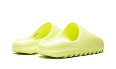 The adidas Yeezy Slide “Glow” is a September 2021 release of the slip-on sandal by Kanye West in a bold colorway.  Designed for comfort, and in this “Glow” style, drawing attention, the Yeezy Slide is an easy-wearing shoe from West’s ever-popular signature footwear line with adidas that excels in bringing a casual vibe to an outfit.  The model’s one-piece, lightweight EVA foam body is dipped in a neon green hue.  Subtle adidas Three Stripes branding appears on the top of the footbed.  The Yeezy 70s Converse, Adidas Campus 80s, Adidas Yeezy Slide, Glow Green, Nike X Travis Scott, Converse Run, Yeezy Slides, Low Air Jordan 1, Converse Run Star