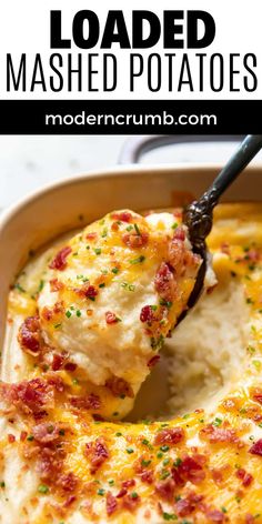 loaded mashed potatoes in a casserole dish with a spatula scooping out