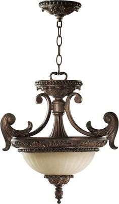 an ornate chandelier with two lights hanging from it's center and one light on