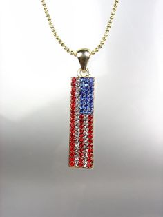 sparkle GOLD RED CLEAR BLUE CRYSTALS RECTANGLE AMERICAN FLAG PENDANT NECKLACE     Gorgeous Shimmer!  Encrusted with sparkling red, clear & blue crystals, this rectangle USA American flag pendant necklace is gorgeous & patriotic. Made in the USA! * MATCHING EARRINGS AVAILABLE *   ***  BRAND NEW  ***   Red Clear Blue Crystals / Gold Plated Diamond-Cut Bead Chain Necklace  MEASURES:  16" Long FLAG:  1 1/2" L  x 10mm W   Visit Our Store   SHOPLOTUSPANDA   Click to see supersized image Payment All Pa Red Patriotic Necklace For 4th Of July, Red Patriotic Jewelry For Independence Day, American Flag Jewelry For 4th Of July Gift, American Flag Jewelry For 4th Of July, Red American Flag Jewelry For Independence Day, Red Jewelry For 4th Of July Gift, Blue Patriotic Necklace For Gift, Patriotic Blue Necklace For Gift, American Flag Jewelry Gift For 4th Of July