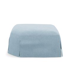 a light blue ottoman cover with pleating on the top and bottom, sitting in front of a white background