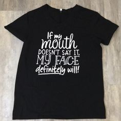 Brand New Graphic T-Shirt “If My Mouth Doesn’t Say It, My Face Definitely Will” Size Medium Funny Black Slogan Top, Funny Black Tops With Slogan, Funny Quote Print Black Tops, Trendy Black Tops With Quote Print, Black Relaxed Fit T-shirt With Quote Print, Black Casual T-shirt With Quote Print, Funny Black T-shirt With Text Print, Smock Blouse, Anime Tees