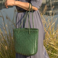 This woven leather handbag is handy. 'Carla' tote that's perfect for everyday use. It features soft yet durable vegetable tan calf leather. Handmade by experienced artisan. Vegetable tanned calf leather - soft and durable.  Use delicate cream to clean and care for the leather. Eco-friendly Woven Leather Shoulder Bag For Shopping, Casual Green Woven Leather Shoulder Bag, Green Bags With Braided Handles For On-the-go, Everyday Green Shoulder Bag With Intrecciato Weave, Eco-friendly Woven Leather Shopping Bag, Eco-friendly Woven Leather Bag, Eco-friendly Woven Leather Shoulder Bag For Everyday Use, Everyday Rectangular Woven Leather Bucket Bag, Eco-friendly Everyday Shoulder Bag With Woven Leather