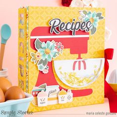 an image of a recipe book on a table with eggs and utensils in the background