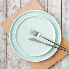 a plate with two forks on top of it