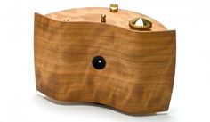 a wooden object with two knobs on it