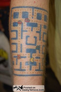 a man's arm with a blue and white tattoo on it that has an image of a maze