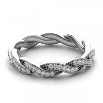 a white gold wedding band with diamonds in the shape of an intertwined knot, on a