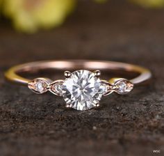 an engagement ring with three stones on it