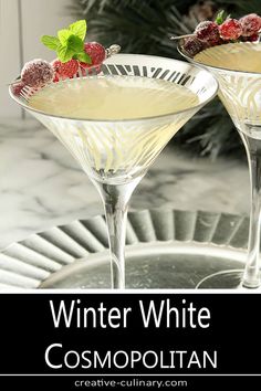 two martinis with raspberries on the rim and text winter white cosmopolian