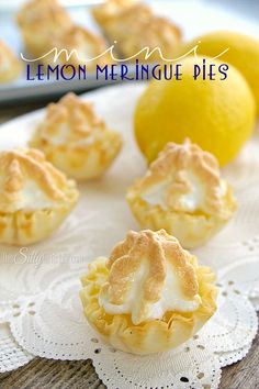 lemon meringue pies on a white doily