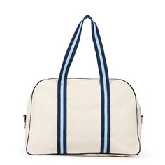 This chic canvas pickleball bag is a classic with its coordinating navy and light blue stripes and details. Made from durable natural canvas, this cute blue pickleball tote has a paddle pocket on the side (fits two paddles) and a roomy interior for all of your gear. Even better, it comes with a navy blue and light blue striped crossbody/shoulder strap so you can carry it in three different ways as you head for the pickleball courts. The exterior pocket can fit two pickleball paddles and includes Sporty Canvas Bag For Weekend, Sporty Canvas Tote Bag, Sporty Rectangular Canvas Shoulder Bag, Sporty Everyday Canvas Bag, Sporty Canvas Bags For Daily Use, Sporty Canvas Bag With Large Capacity, Large Capacity Sporty Canvas Bags, Sporty Rectangular Canvas Bag, Sporty Canvas Shoulder Bag For On-the-go