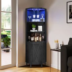 a black cabinet with liquor bottles and glasses on it