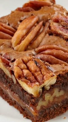 a piece of pecan brownie on a white plate