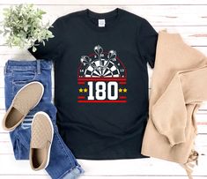 This Dart shirt with the saying 180 is a fun gift for men and women!  darts 180 tees,darts shirt,dart players,dart gifts,darts tshirt,dart tshirts,sports shirt,dart lover,darts coach,darts t-shirt,darts t shirt,  * All shirts are unisex. * Product measurements may vary by up to 2 inches. * All Designs are originally made by myself To see more designs of your topic Dart you can search & find them in the store:   https://www.etsy.com/shop/Retailorie  You find there also an announcement if the shipping & production times change : Coach Shirt, Dart Shirts, Coach Shirts, Sports Shirt, Best Gifts For Men, Sport Shirt, Sports Shirts, Gift For Men, Dart