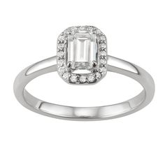 You'll adore the sleek style of this 14k white gold moissanite emerald-cut halo ring. RING DETAILS Width: 9.2 mm. Metal: rhodium-plated 14k white gold Includes: gift box & warranty card By Charles & Colvard  STONE DETAILS Stone type: lab-created moissanite Total weight diamond equivalent: 5/8 ct. Cut:emerald Setting: prong  Diamond equivalent carat (ct.) Total Weight (T.W.) represents the approximate total weight of diamonds of equivalent appearance.Please note, due to the high value of Classic Platinum Emerald Ring With Halo Design, Platinum Emerald Cut Emerald Ring With Halo Design, Classic White Gold Emerald Ring With Halo Setting, Silver Emerald Cut Diamond Ring With Halo, Platinum White Gold Emerald Ring With Halo Design, Formal White Gold Emerald Ring With Halo, Classic White Gold Emerald Ring With Halo Design, Silver Platinum Emerald Ring With Halo Design, Silver Emerald Ring With Halo Design In Platinum