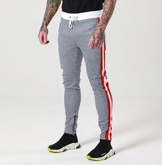 Street Style Stretch Bottoms With Side Stripes For Streetwear, Black Sports Trousers, Stretch Hip Hop Pants For Sports, Stretch Hip Hop Gym Pants, Stretch Pants With Side Stripes For Jogging, Fitted Bottoms With Side Stripes For Streetwear, Streetwear Stretch Pants With Side Stripes, Sporty Black Pants With Side Stripes, Stretch Pants With Side Stripes For Streetwear