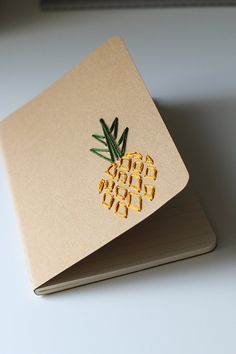 a notebook with a pineapple sticker on it