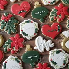 decorated christmas cookies on a wooden table with merry message and ornaments in the shape of hearts