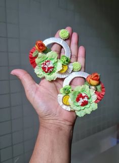 Handmade Beautiful Oversized Orange and Lime Green Floral Hoop Earrings. These stunning handmade earrings feature oversized hoops adorned with vibrant orange and lime green floral designs. Perfect for adding a bold pop of color to any outfit, they exude a lively and playful summer vibe. Despite their size, these earrings are lightweight, making them comfortable to wear all day long. The bright, cheerful colors make them a must-have accessory for the summer season, adding a touch of nature-inspir Bohemian Earrings With Handmade Flowers For Beach, Bohemian Handmade Flower Earrings For Beach, Bohemian Beach Earrings With Handmade Flowers, Handmade White Hoop Flower Earrings, Green Flower-shaped Earrings For Beach, Green Flower Earrings For Beach, Green Flower-shaped Beach Earrings, Beach Earrings With Handmade Flower Shapes, Beach Earrings With Handmade Flower Details