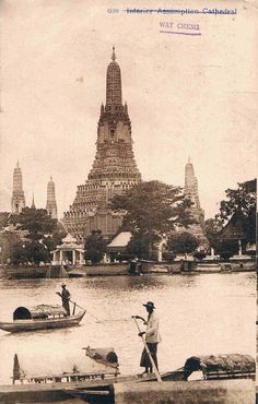 an old black and white photo of some people in boats