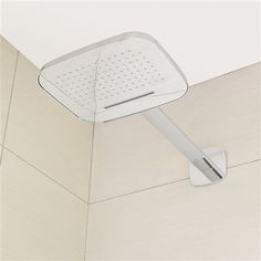 an overhead shower head in a bathroom