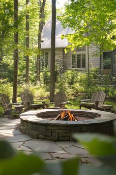 Backyard fire pit surrounded by wooden chairs, with a forest and house in the background. Fire Pit Designs Backyard, Limestone Fire Pit, Rustic Fire Pit Ideas, Rustic Fire Pit, Cozy Fire Pit, Story Settings, Bonfire Pits, Sunken Fire Pits, Big Valley