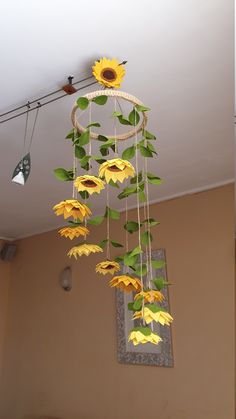 the sunflowers are hanging from the ceiling