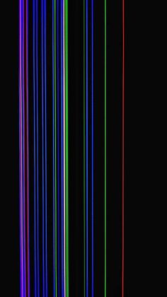 an image of multicolored lines in the dark