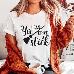 Funny Halloween t-shirt features the quote "yes, I can drive a stick" in black lettering with a broomstick illustration. Get into gear this Halloween and unleash your inner witch with this cute quote tee! Cricut Halloween Tshirt Ideas, Halloween Tshirt Ideas, Inner Witch, Cricut Shirts, Cute Quote, Cricut Halloween, Sublimation Projects, Halloween Tshirt, Yes I Can