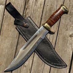 a knife is sitting on top of a leather sheath